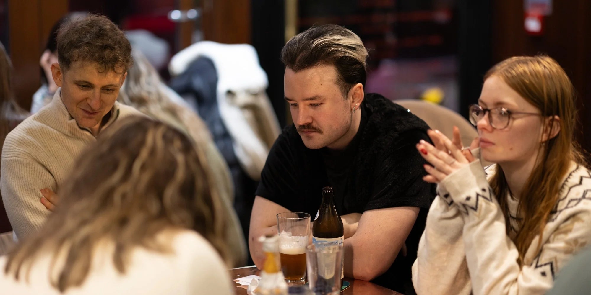 Young Professionals Enjoy a Pub Meet Up With Alcohol Free Drinks